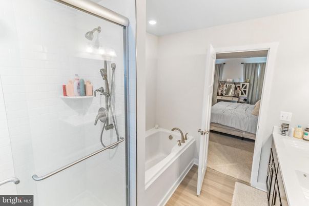 Bathroom, Bedroom, Glass Shower, Interior, Recessed Lighting, Wood Texture Flooring