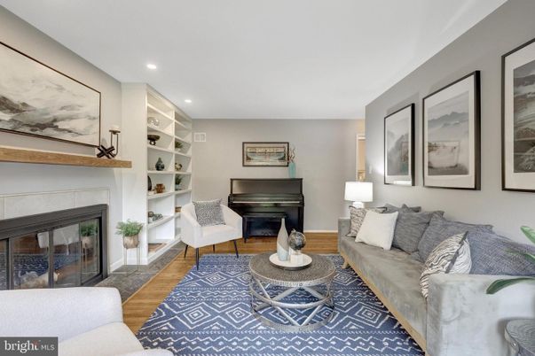 Fireplace, Interior, Living room, Piano, Recessed Lighting, Wood Texture Flooring