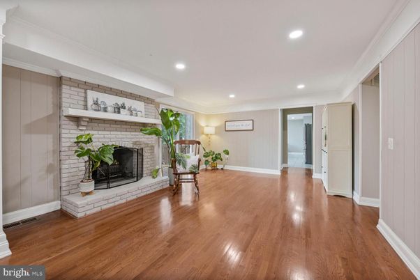 Empty room, Fireplace, Interior, Recessed Lighting, Stone Walls, Wood Texture Flooring