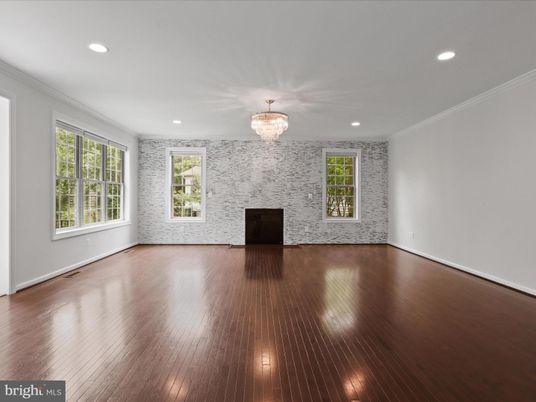 Chandelier, Empty room, Fireplace, Interior, Recessed Lighting, Wood Texture Flooring