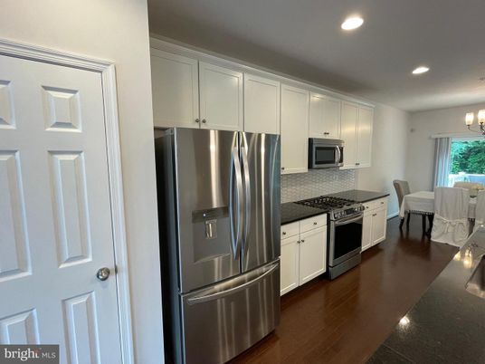 Chandelier, Dining room, Interior, Kitchen, Recessed Lighting, Stainless Steel Appliances, Wood Texture Flooring