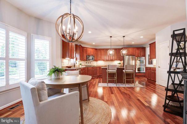 Dining room, Interior, Kitchen, Pendant Lights, Recessed Lighting, Stainless Steel Appliances, Wood Texture Flooring