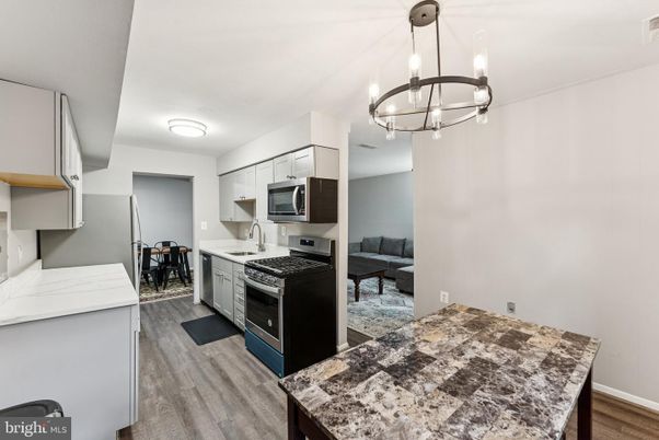Chandelier, Interior, Kitchen, Pendant Lights, Stainless Steel Appliances, Wood Texture Flooring