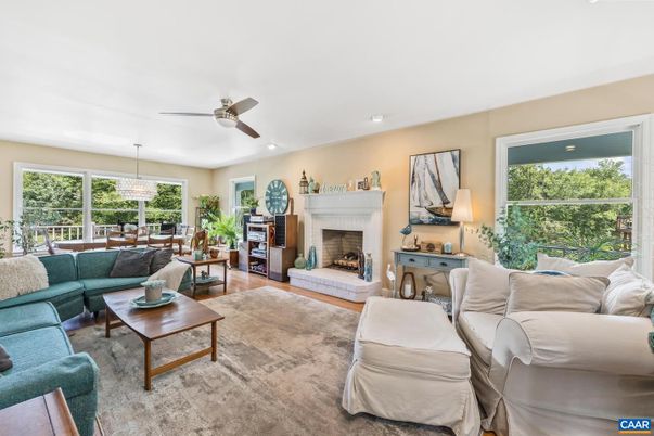 Chandelier, Dining room, Fireplace, Interior, Living room, Pendant Lights, Recessed Lighting, Wood Texture Flooring