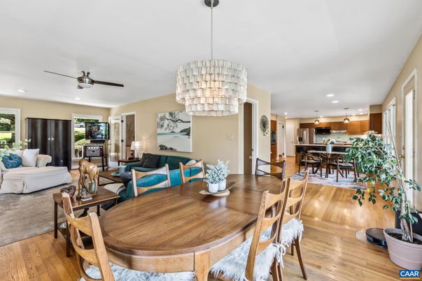 Chandelier, Dining room, Interior, Kitchen, Living room, Pendant Lights, Recessed Lighting, Stainless Steel Appliances, Wood Texture Flooring