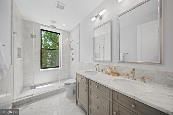 Bathroom, Dual Sink Vanities, Glass Shower, Interior, Marble, Marble Walls, Recessed Lighting