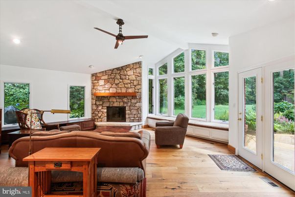 Fireplace, Interior, Living room, Recessed Lighting, Stone Walls, Wood Texture Flooring