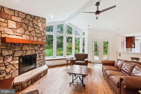 Fireplace, Interior, Living room, Recessed Lighting, Stone Walls, Wood Texture Flooring