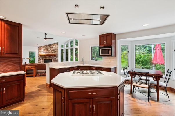 Dining room, Fireplace, Interior, Kitchen, Recessed Lighting, Stone Walls, Wood Texture Flooring