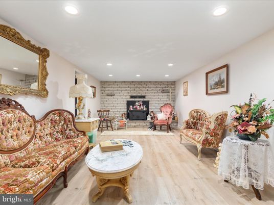 Fireplace, Interior, Living room, Recessed Lighting, Stone Walls, Wood Texture Flooring