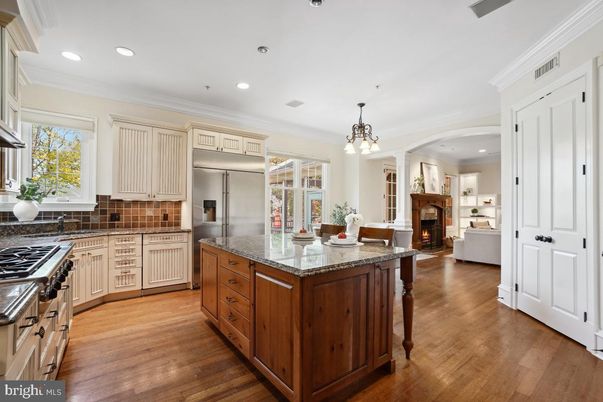 Chandelier, Fireplace, Interior, Kitchen, Pendant Lights, Recessed Lighting, Stainless Steel Appliances, Wood Texture Flooring