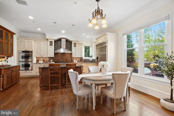 Chandelier, Dining room, Interior, Kitchen, Recessed Lighting, Stainless Steel Appliances, Wood Texture Flooring