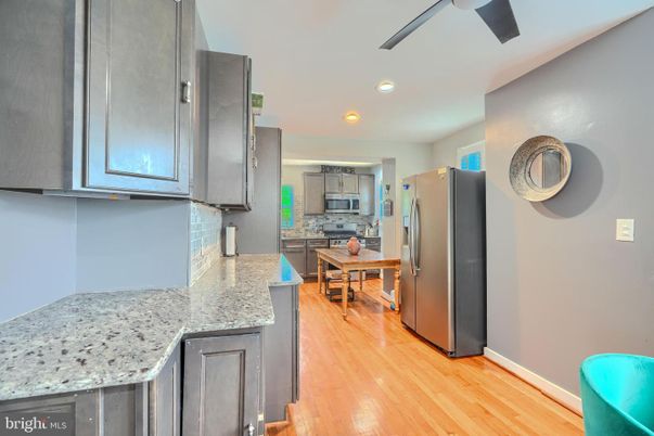 Dining room, Interior, Kitchen, Recessed Lighting, Stainless Steel Appliances, Wood Texture Flooring