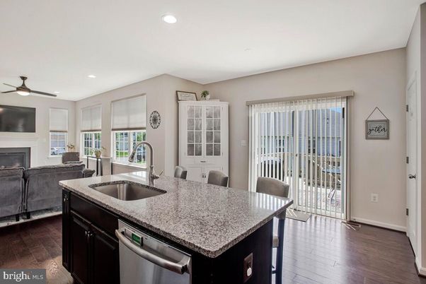Dining room, Fireplace, Interior, Kitchen, Recessed Lighting, Wood Texture Flooring