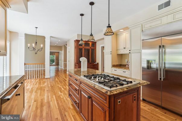 Chandelier, Interior, Kitchen, Pendant Lights, Recessed Lighting, Stainless Steel Appliances, Wood Texture Flooring