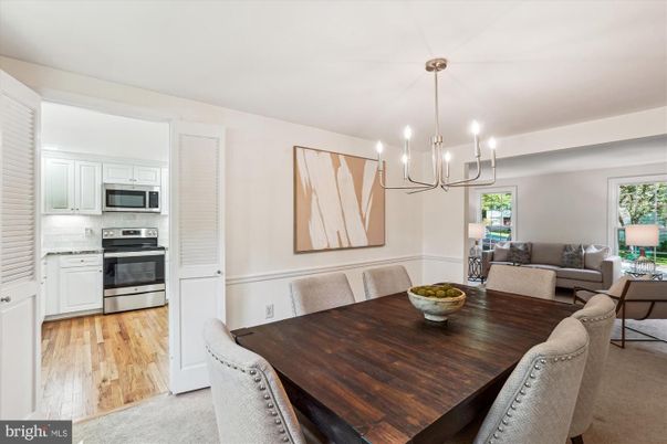 Chandelier, Dining room, Interior, Kitchen, Living room, Pendant Lights, Stainless Steel Appliances, Wood Texture Flooring