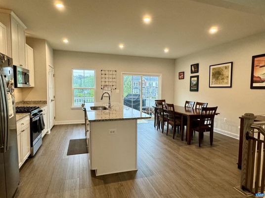 Dining room, Interior, Kitchen, Recessed Lighting, Stainless Steel Appliances, Wood Texture Flooring