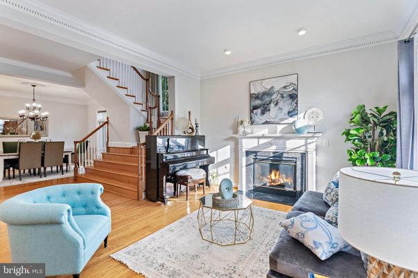 Chandelier, Dining room, Fireplace, Interior, Living room, Piano, Recessed Lighting, Wood Texture Flooring