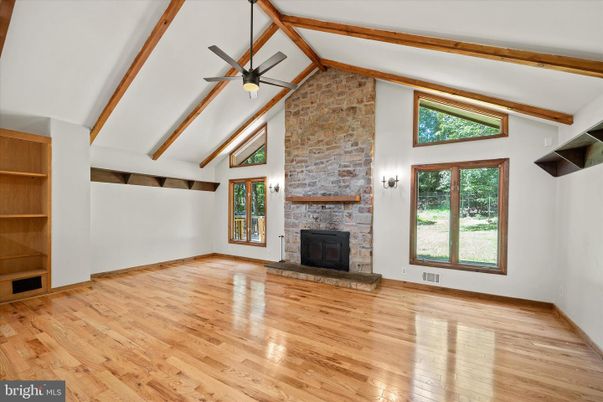 Empty room, Fireplace, Interior, Stone Walls, Wooden Beams, Wood Texture Flooring