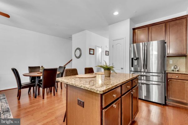 Dining room, Interior, Kitchen, Recessed Lighting, Stainless Steel Appliances, Wood Texture Flooring