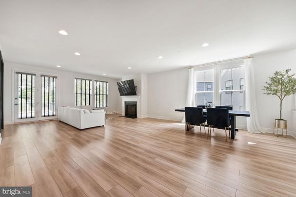 Dining room, Fireplace, Interior, Living room, Recessed Lighting, Wood Texture Flooring