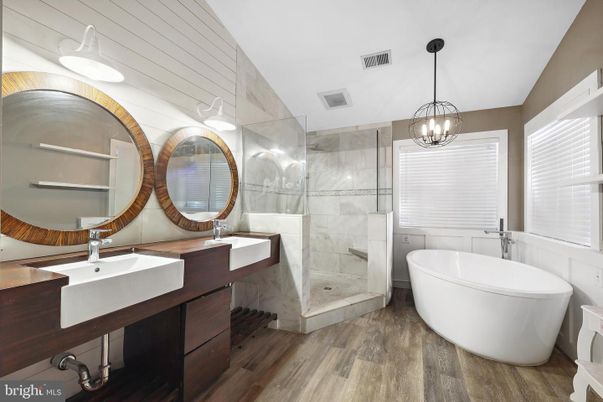 Bathroom, Dual Sink Vanities, Free Standing Baths, Glass Shower, Interior, Pendant Lights, Wood Texture Flooring