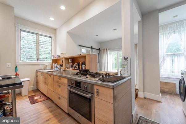 Interior, Kitchen, Recessed Lighting, Washer, Wood Texture Flooring