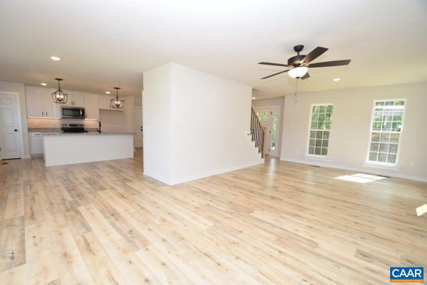 Empty room, Interior, Kitchen, Pendant Lights, Recessed Lighting, Stainless Steel Appliances, Wood Texture Flooring