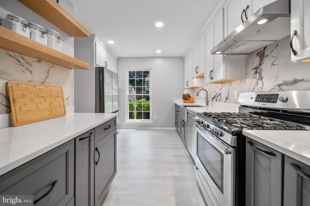 Interior, Kitchen, Marble Walls, Recessed Lighting, Stainless Steel Appliances