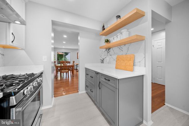 Dining room, Interior, Kitchen, Marble Walls, Recessed Lighting, Stainless Steel Appliances, Wood Texture Flooring