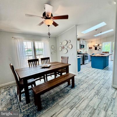 Dining room, Interior, Kitchen, Pendant Lights, Stainless Steel Appliances, Wood Texture Flooring