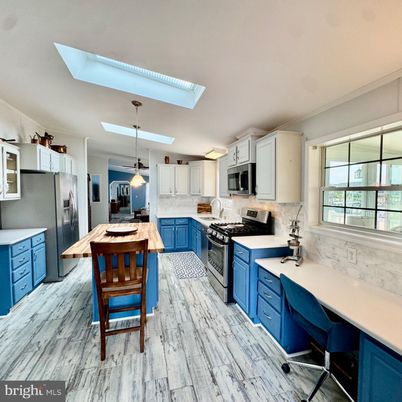 Dining room, Interior, Kitchen, Pendant Lights, Stainless Steel Appliances, Wood Texture Flooring