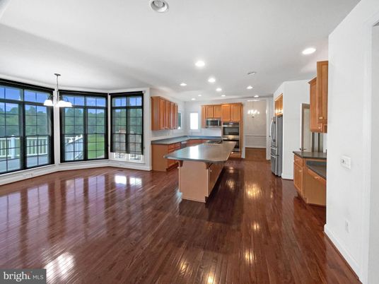 Empty room, Interior, Kitchen, Pendant Lights, Recessed Lighting, Stainless Steel Appliances, Wood Texture Flooring