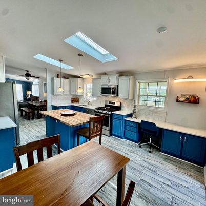Dining room, Interior, Kitchen, Pendant Lights, Stainless Steel Appliances, Wood Texture Flooring