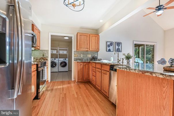 Interior, Kitchen, Recessed Lighting, Washer, Wood Texture Flooring