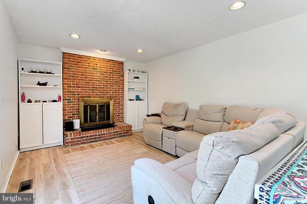 Fireplace, Interior, Living room, Recessed Lighting, Stone Walls, Wood Texture Flooring