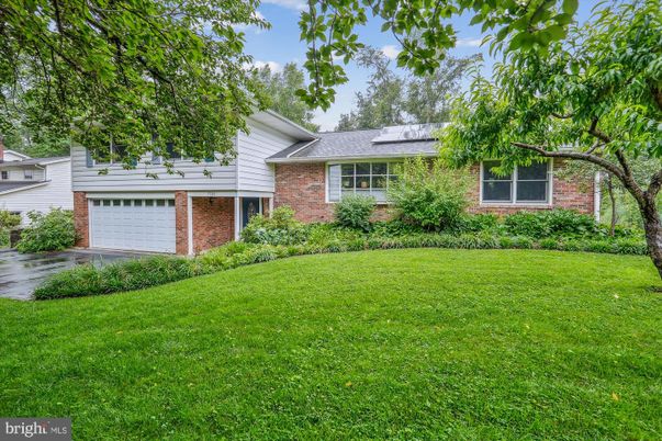 Attached, Backyard, Exterior, Facade, Brick Facade, Solar Panels, Split Level