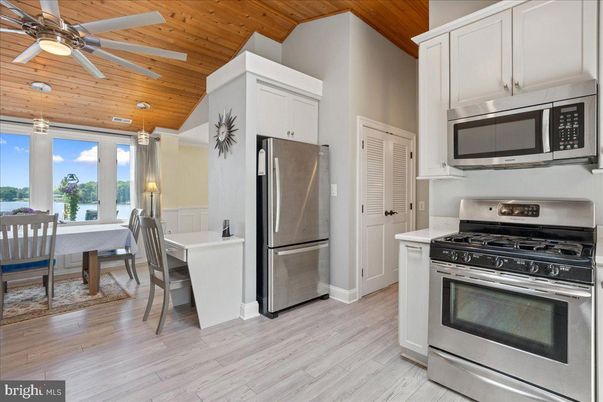 Dining room, Interior, Kitchen, Recessed Lighting, Stainless Steel Appliances, Wooden Ceilings, Wood Texture Flooring