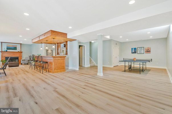 Fireplace, Game Room, Interior, Pendant Lights, Recessed Lighting, Wood Texture Flooring