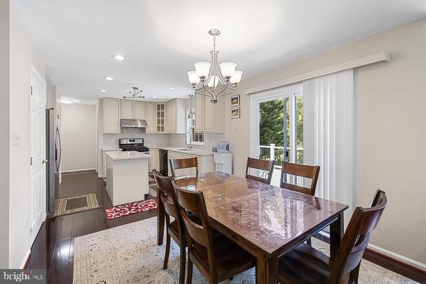 Chandelier, Dining room, Interior, Kitchen, Recessed Lighting, Stainless Steel Appliances, Wood Texture Flooring