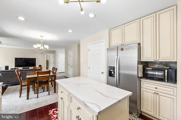 Chandelier, Dining room, Interior, Kitchen, Recessed Lighting, Stainless Steel Appliances, Wood Texture Flooring