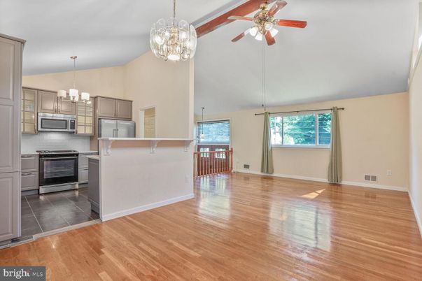 Chandelier, Empty room, Interior, Kitchen, Pendant Lights, Stainless Steel Appliances, Wood Texture Flooring