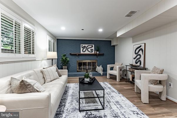 Fireplace, Interior, Living room, Recessed Lighting, Stone Walls, Wood Texture Flooring