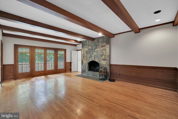Empty room, Fireplace, Interior, Recessed Lighting, Stone Walls, Wooden Beams, Wood Texture Flooring