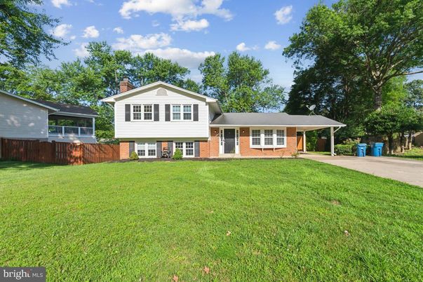 Attached, Backyard, Exterior, Facade, Brick Facade, Split Level