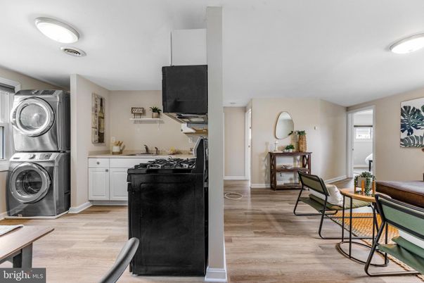 Interior, Kitchen, Recessed Lighting, Washer, Wood Texture Flooring