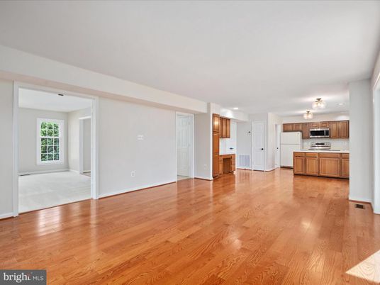 Empty room, Interior, Kitchen, Recessed Lighting, Stainless Steel Appliances, Wood Texture Flooring