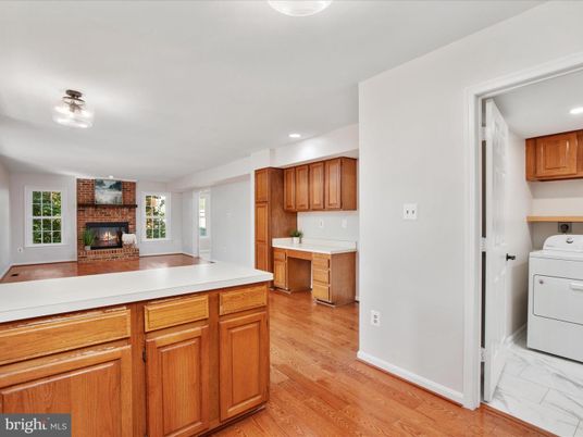 Fireplace, Interior, Kitchen, Recessed Lighting, Washer, Wood Texture Flooring