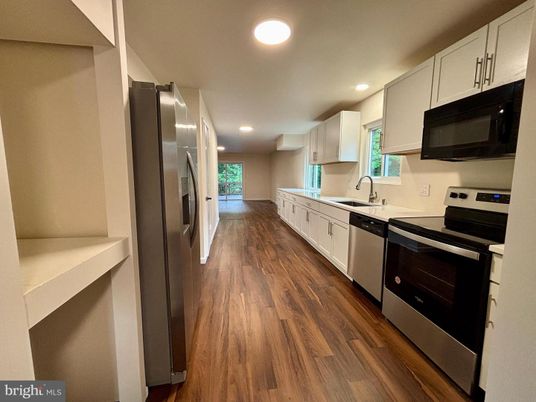 Interior, Kitchen, Recessed Lighting, Stainless Steel Appliances, Wood Texture Flooring