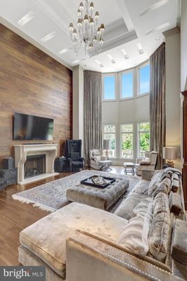 Chandelier, Fireplace, Interior, Living room, Recessed Lighting, Wood Texture Flooring, Wooden Walls